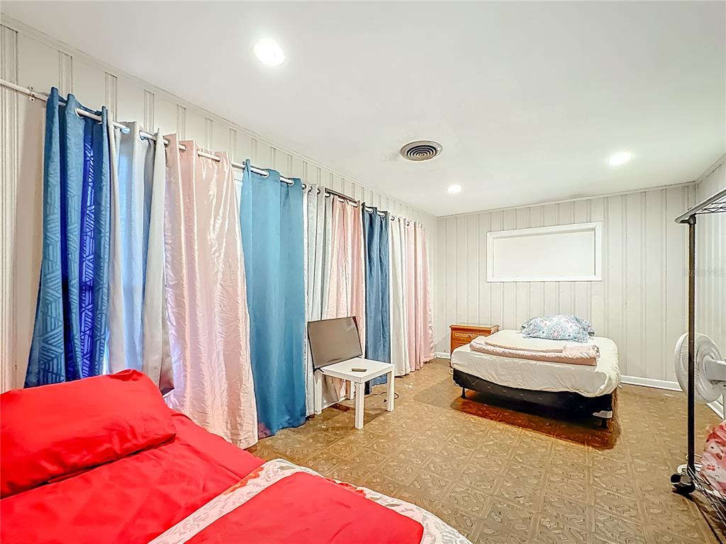 4200 Anderson Road Orlando, FL 32812 - Photo 16 of 63 a bedroom with a bed and a window