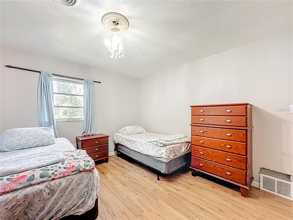 4200 Anderson Road Orlando, FL 32812 - Photo 27 of 63 a bedroom with two beds and a window