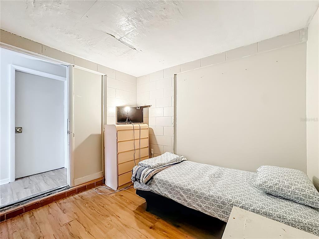 4200 Anderson Road Orlando, FL 32812 - Photo 39 of 63 a bedroom with a bed and walk in closet