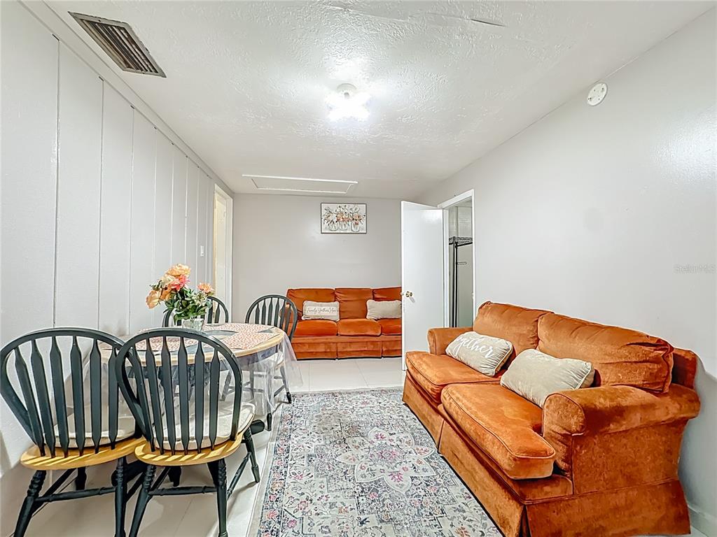 4200 Anderson Road Orlando, FL 32812 - Photo 42 of 63 a bedroom with furniture and a rug