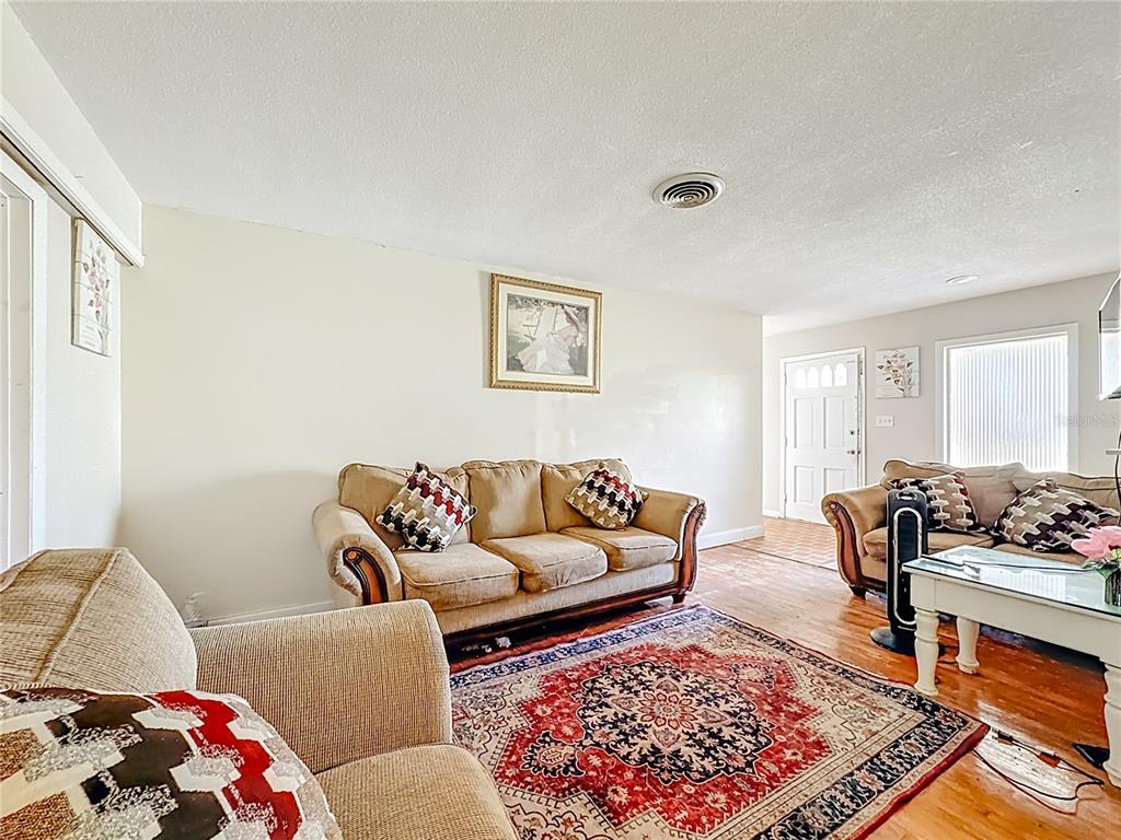 4200 Anderson Road Orlando, FL 32812 - Photo 8 of 63 a living room with furniture and a couch