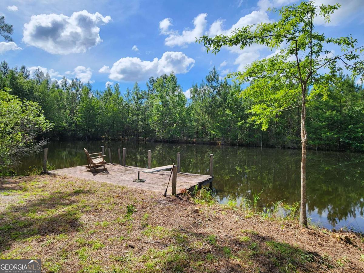 0 Stillwell Clyo Road Springfield, GA 31329 - Photo 1 of 1 a backyard of a house with lots of green space and lake view