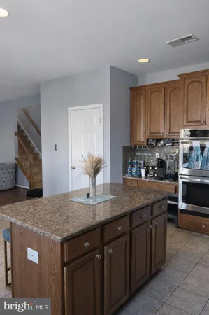 a spacious bedroom with a bed and a flat screen tv