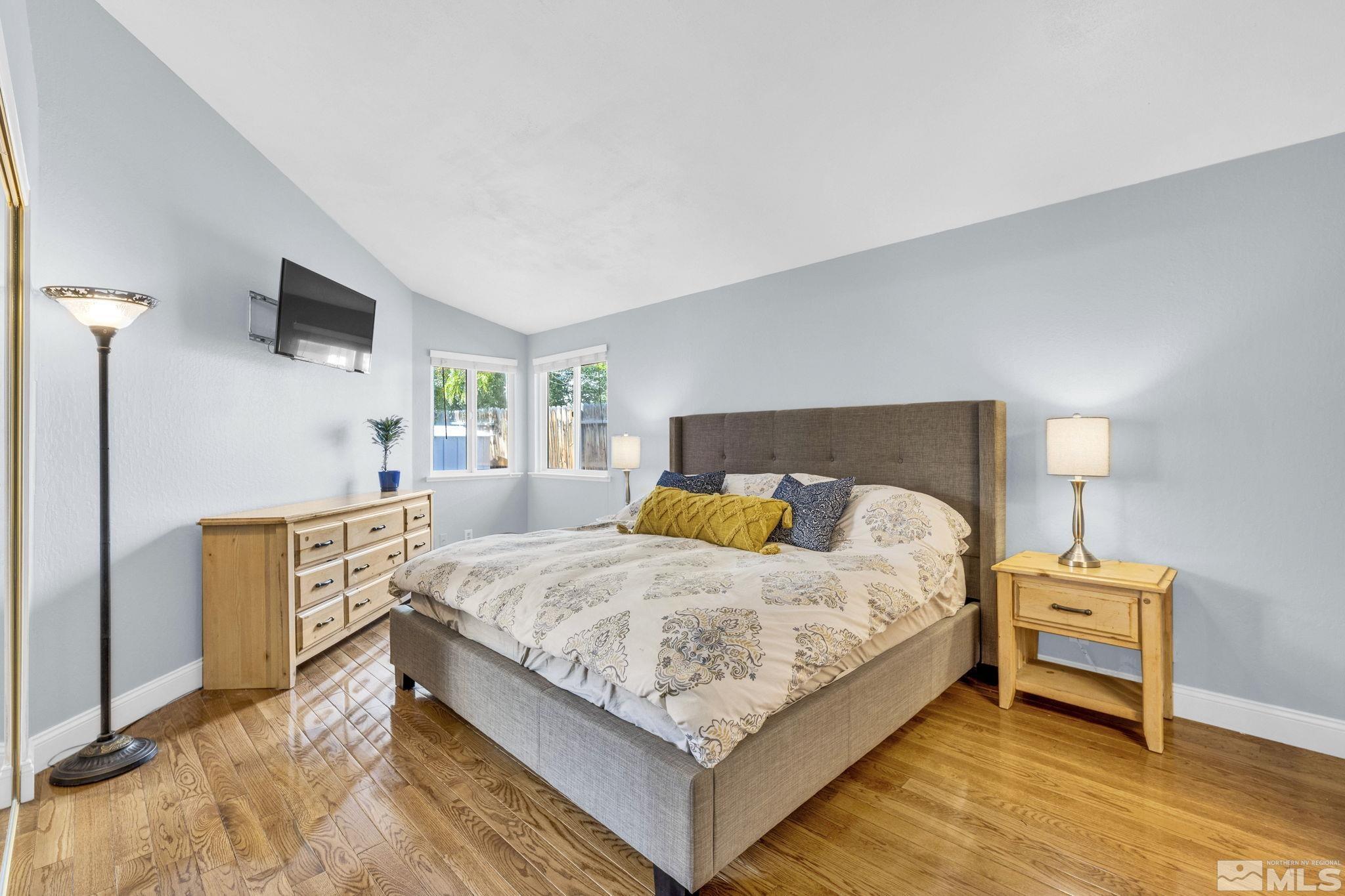 6314 Chesterfield Lane Reno, NV 89523 - Photo 16 of 35 a bedroom with a bed and a flat screen tv