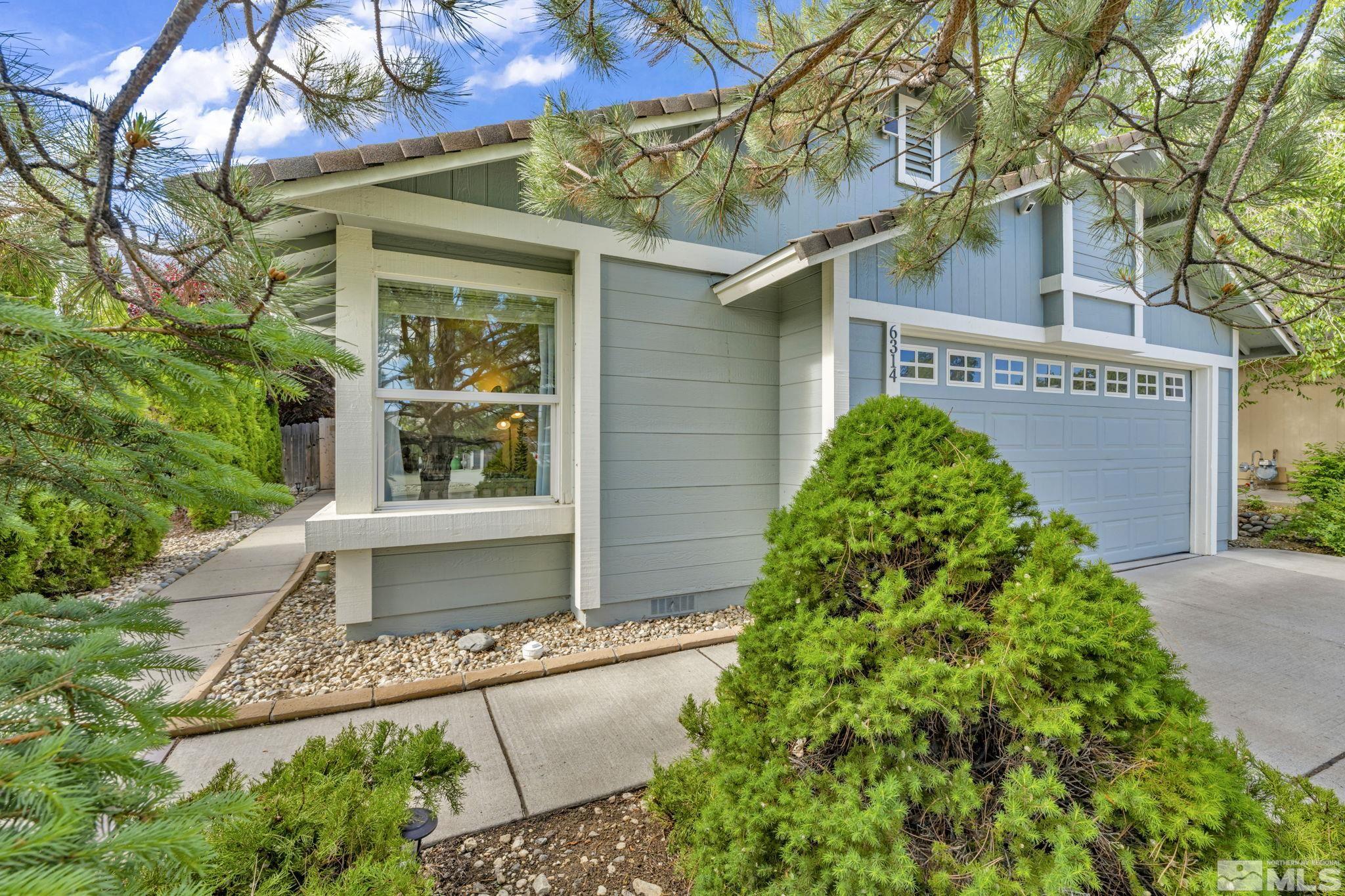 6314 Chesterfield Lane Reno, NV 89523 - Photo 3 of 35 front view of a house with a small yard