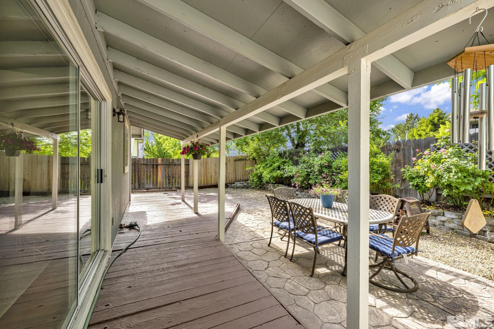 6314 Chesterfield Lane Reno, NV 89523 - Photo 31 of 35 a patio with glass windows and table