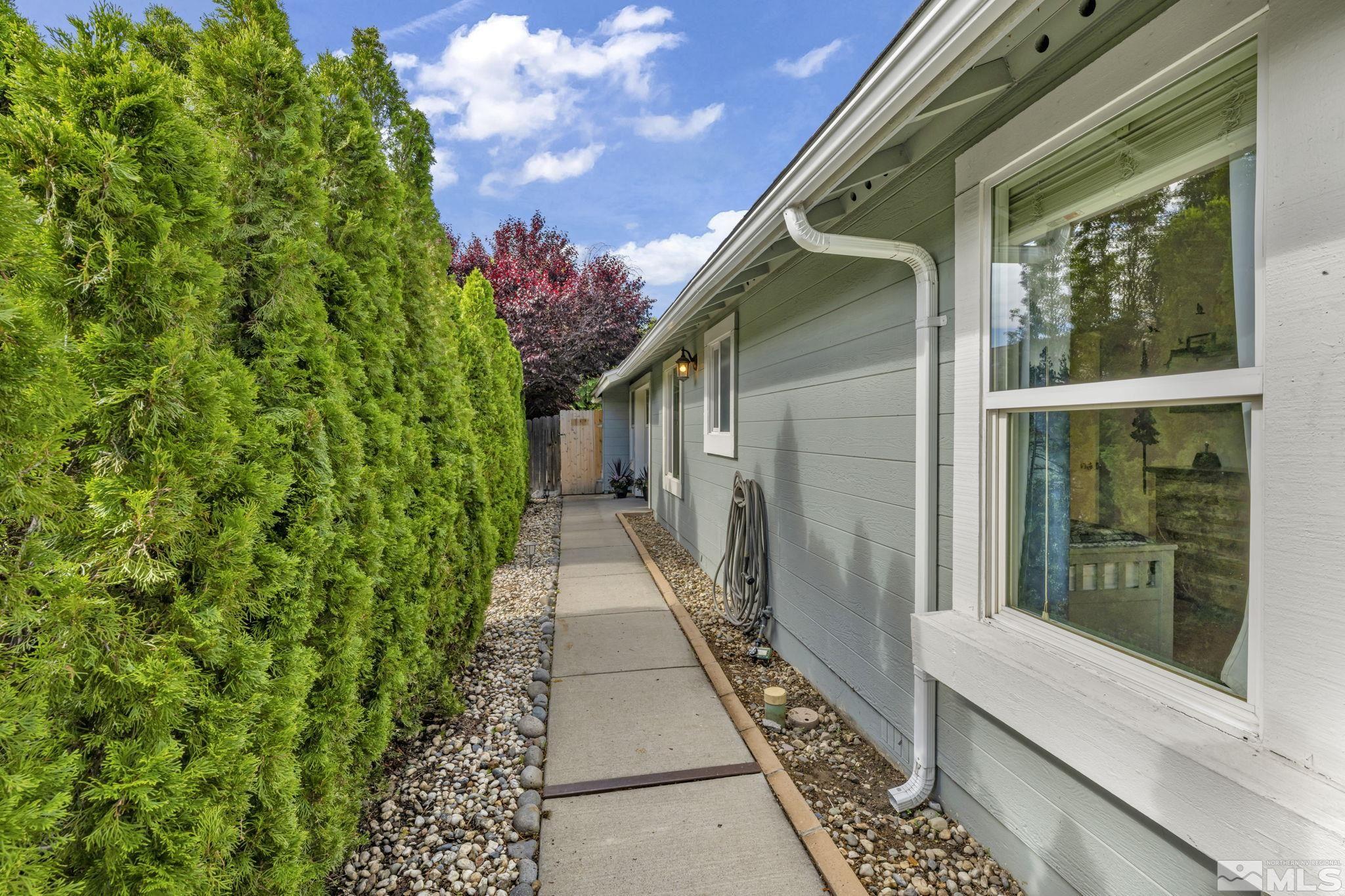 6314 Chesterfield Lane Reno, NV 89523 - Photo 4 of 35 a path view of a house with a porch