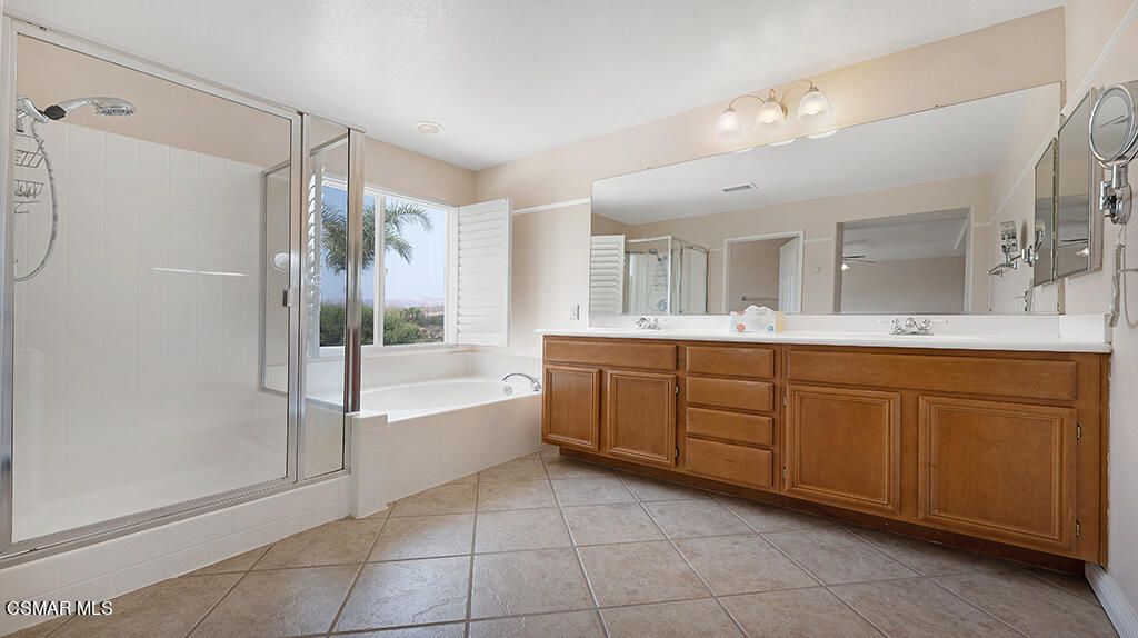 3443 Pine View Drive Simi Valley, CA 93065 - Photo 17 of 32 a spacious bathroom with a mirror sink and bathtub