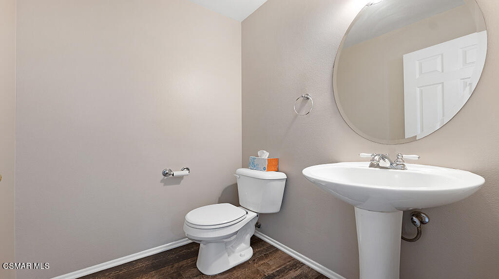 3443 Pine View Drive Simi Valley, CA 93065 - Photo 23 of 32 a bathroom with a sink toilet and mirror