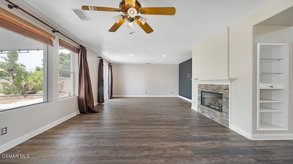3443 Pine View Drive Simi Valley, CA 93065 - Photo 8 of 32 a view of an empty room with a fireplace and a window