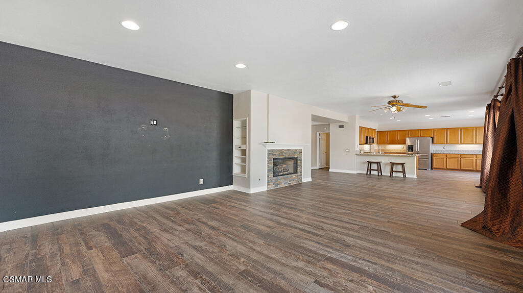 3443 Pine View Drive Simi Valley, CA 93065 - Photo 10 of 32 a view of a livingroom with furniture wooden floor and a fireplace