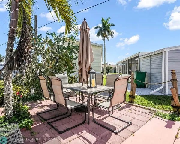 a view of a lounge chairs in the backyard