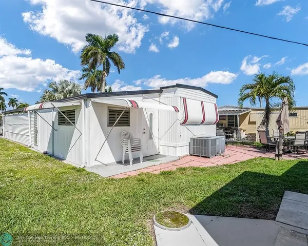 a view of a backyard with a patio