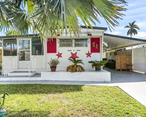 a front view of house with outdoor space