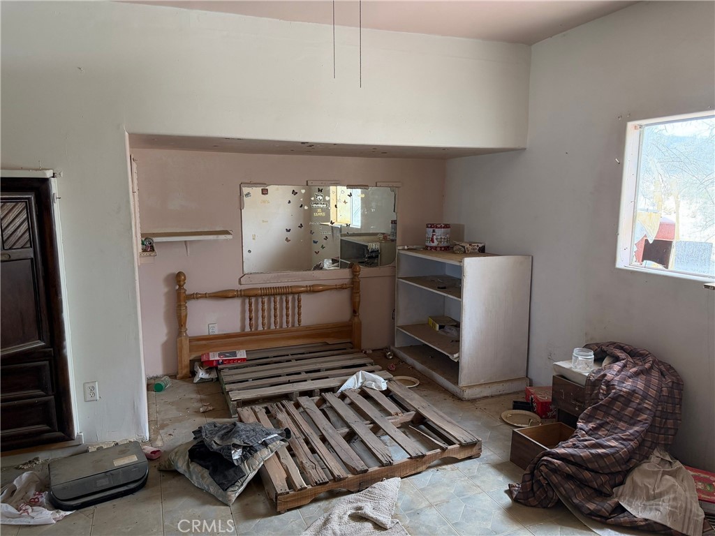 6316 Isleta Road Twentynine Palms, CA 92277 - Photo 5 of 13 a room with furniture or chandelier and a window