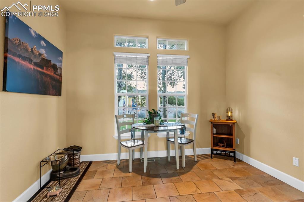204 Storm Ridge Drive Canon City, CO 81212 - Photo 19 of 50 a dining room with furniture and floor to ceiling window