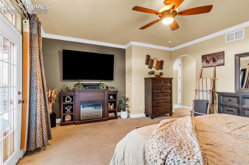 204 Storm Ridge Drive Canon City, CO 81212 - Photo 22 of 50 a bedroom with a bed and a flat screen tv