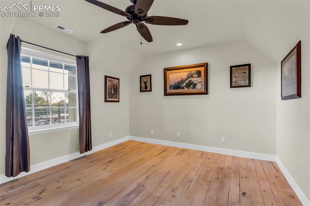 204 Storm Ridge Drive Canon City, CO 81212 - Photo 33 of 50 a view of empty room with wooden floor and fan