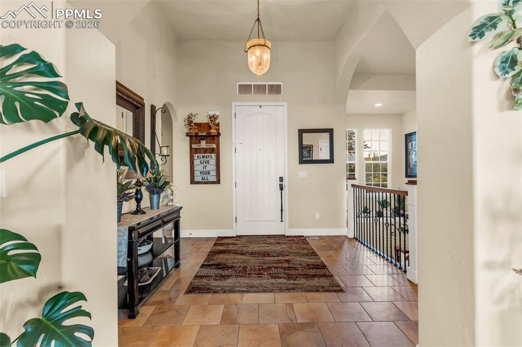 204 Storm Ridge Drive Canon City, CO 81212 - Photo 6 of 50 a view of a hallway with wooden floor and entryway