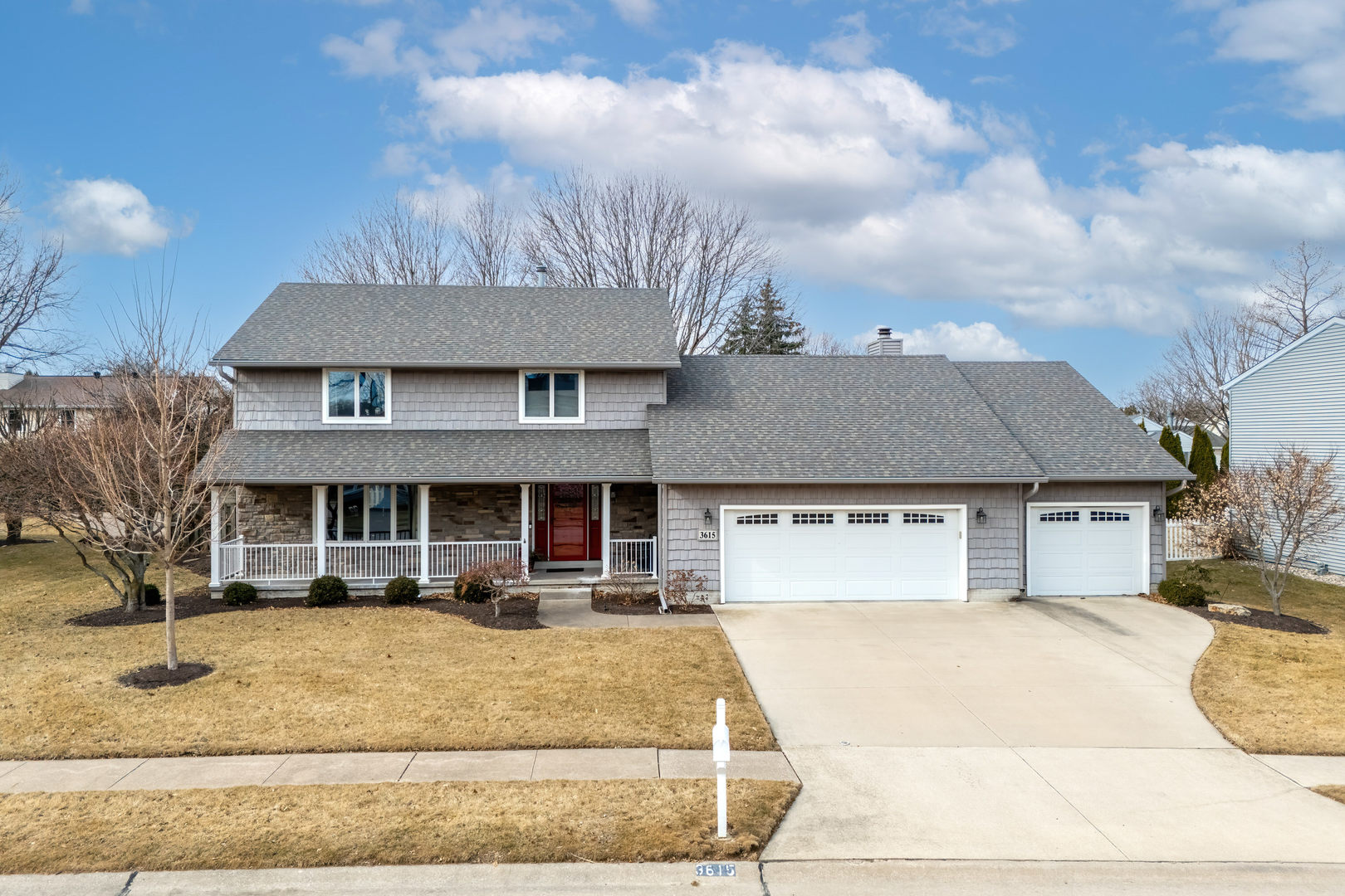 3615 74th Street Moline, IL 61265 - Photo 1 of 44 a front view of a house with a yard