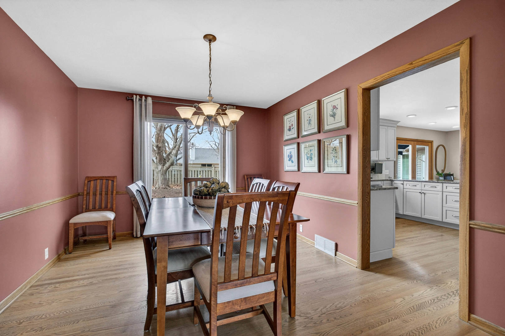 3615 74th Street Moline, IL 61265 - Photo 12 of 44 a view of a dining room with furniture window and wooden floor