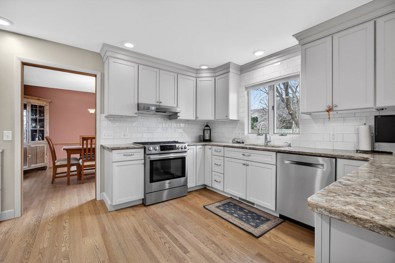 3615 74th Street Moline, IL 61265 - Photo 17 of 44 a kitchen with a stove sink and cabinets