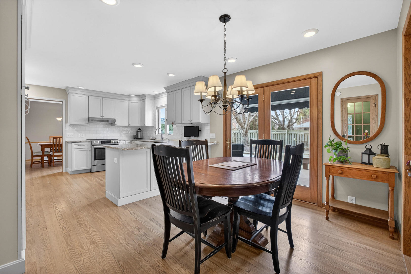 3615 74th Street Moline, IL 61265 - Photo 19 of 44 a view of a dining room with furniture window and wooden floor