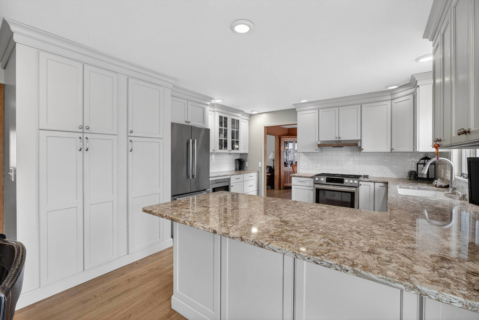 3615 74th Street Moline, IL 61265 - Photo 20 of 44 a kitchen with stainless steel appliances granite countertop a stove a sink and a refrigerator