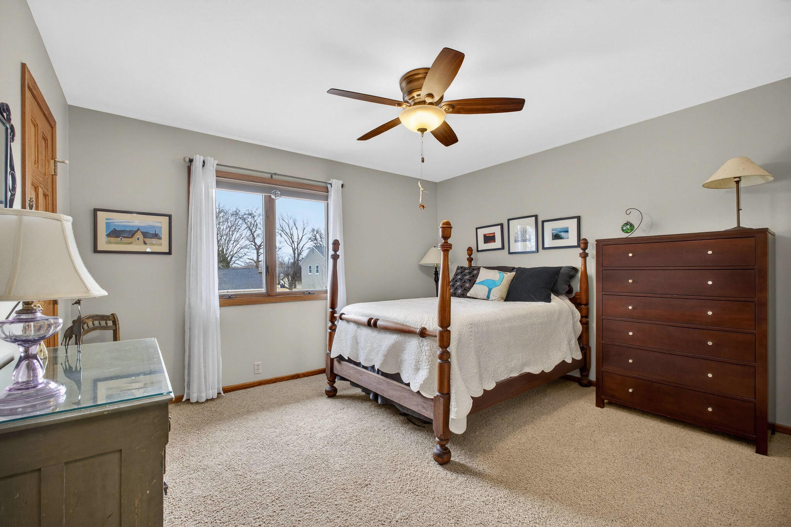 3615 74th Street Moline, IL 61265 - Photo 27 of 44 a bedroom with a bed and a chandelier