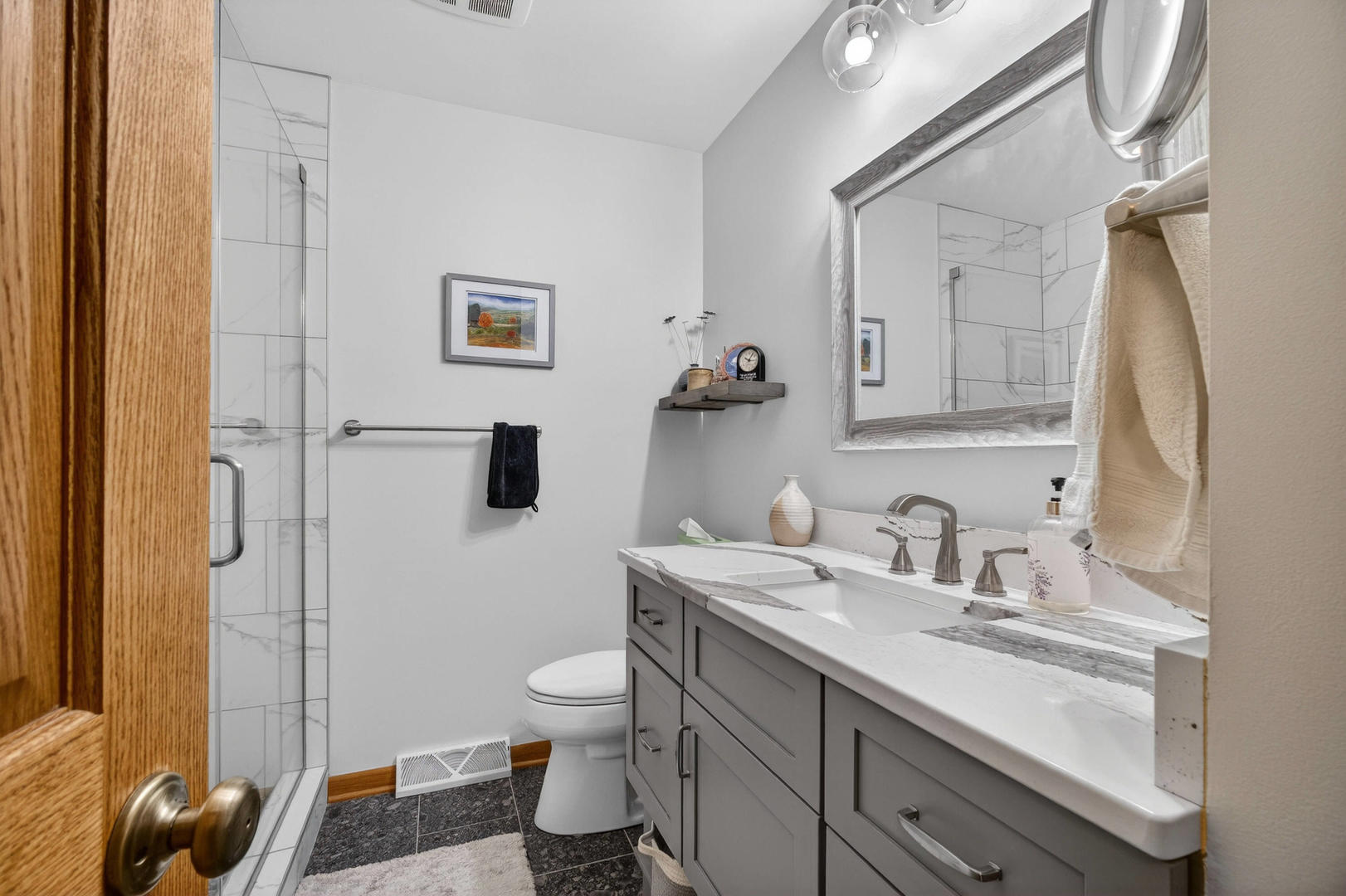 3615 74th Street Moline, IL 61265 - Photo 28 of 44 a bathroom with a granite countertop sink toilet and shower
