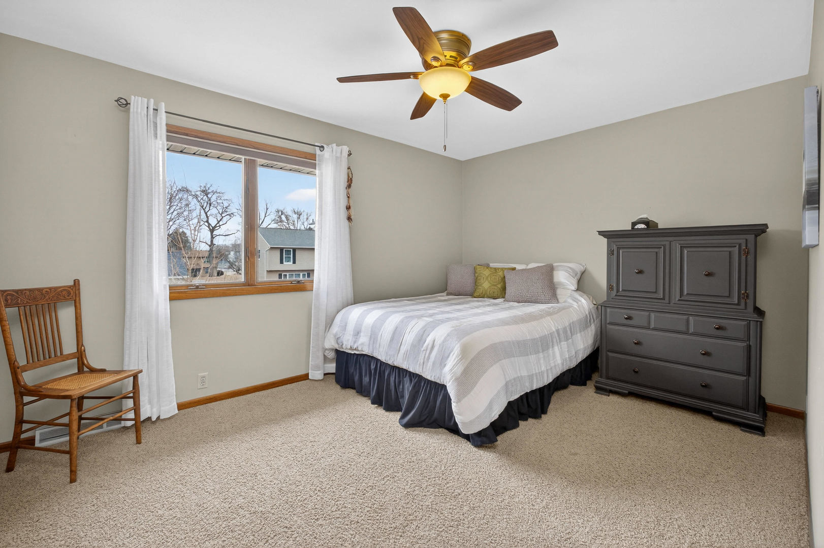 3615 74th Street Moline, IL 61265 - Photo 30 of 44 a bedroom with a bed and chair