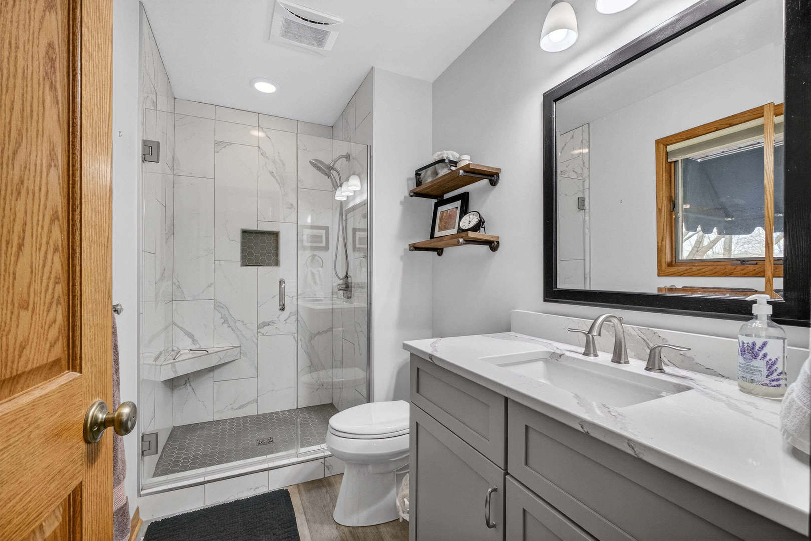 3615 74th Street Moline, IL 61265 - Photo 34 of 44 a bathroom with a granite countertop sink toilet and shower