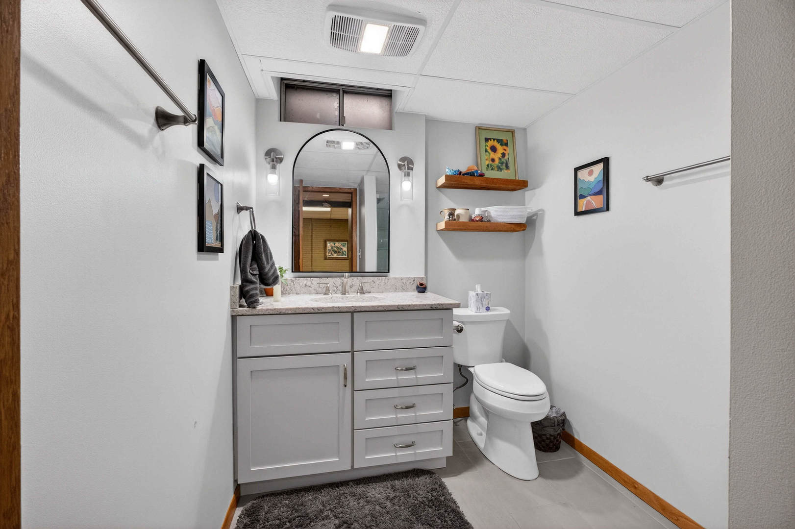 3615 74th Street Moline, IL 61265 - Photo 38 of 44 a bathroom with a toilet sink and mirror