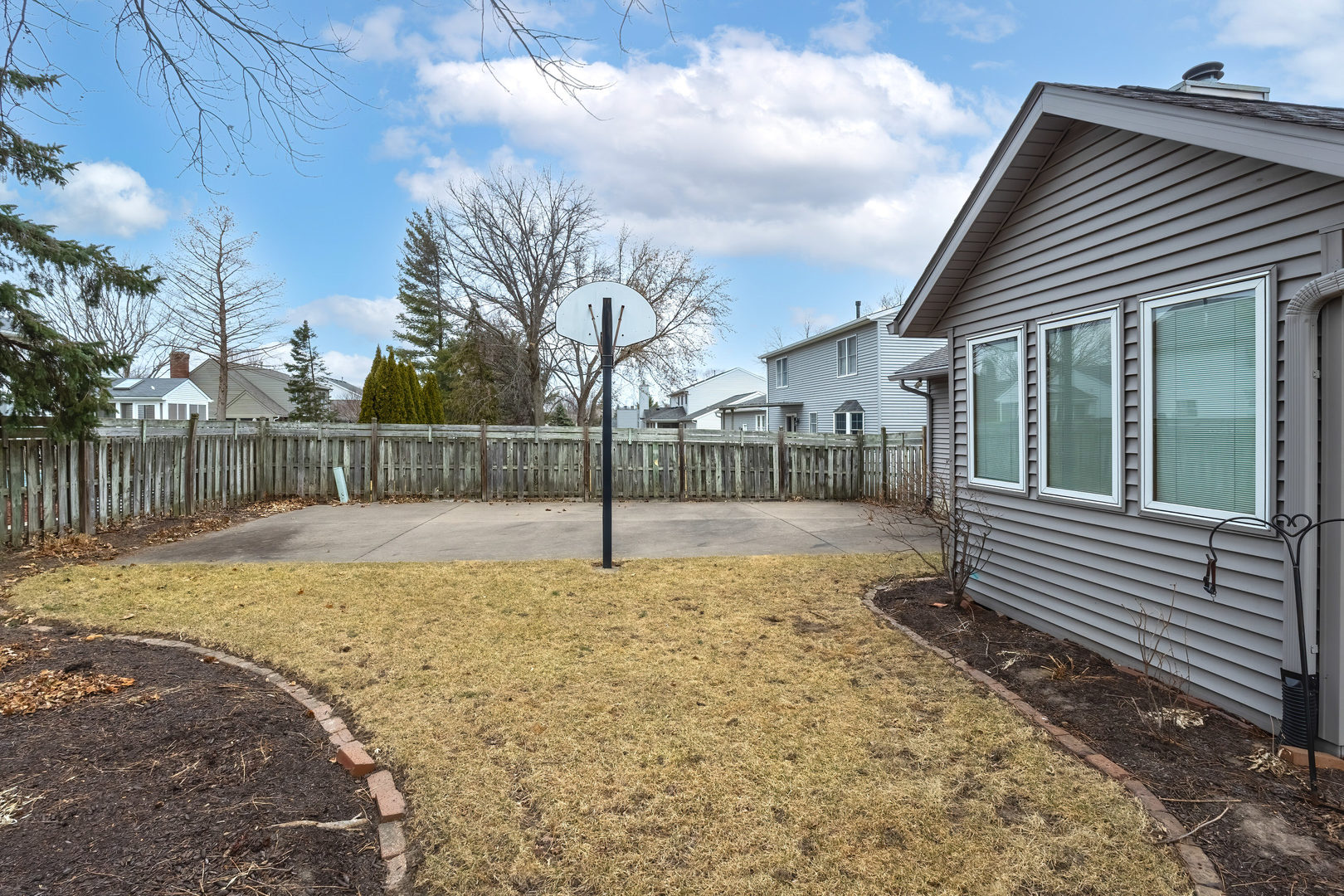 3615 74th Street Moline, IL 61265 - Photo 43 of 44 a view of a backyard with a fence