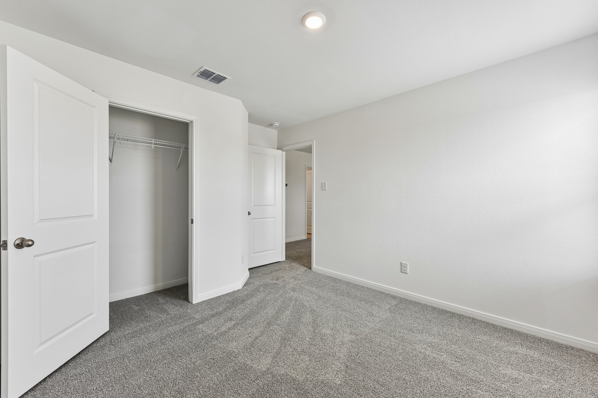 346 Low Pasture Trail Maxwell, TX 78656 - Photo 14 of 29 Carpeted room featuring a double-door closet with wire shelving, white interior doors, and recessed ceiling lighting