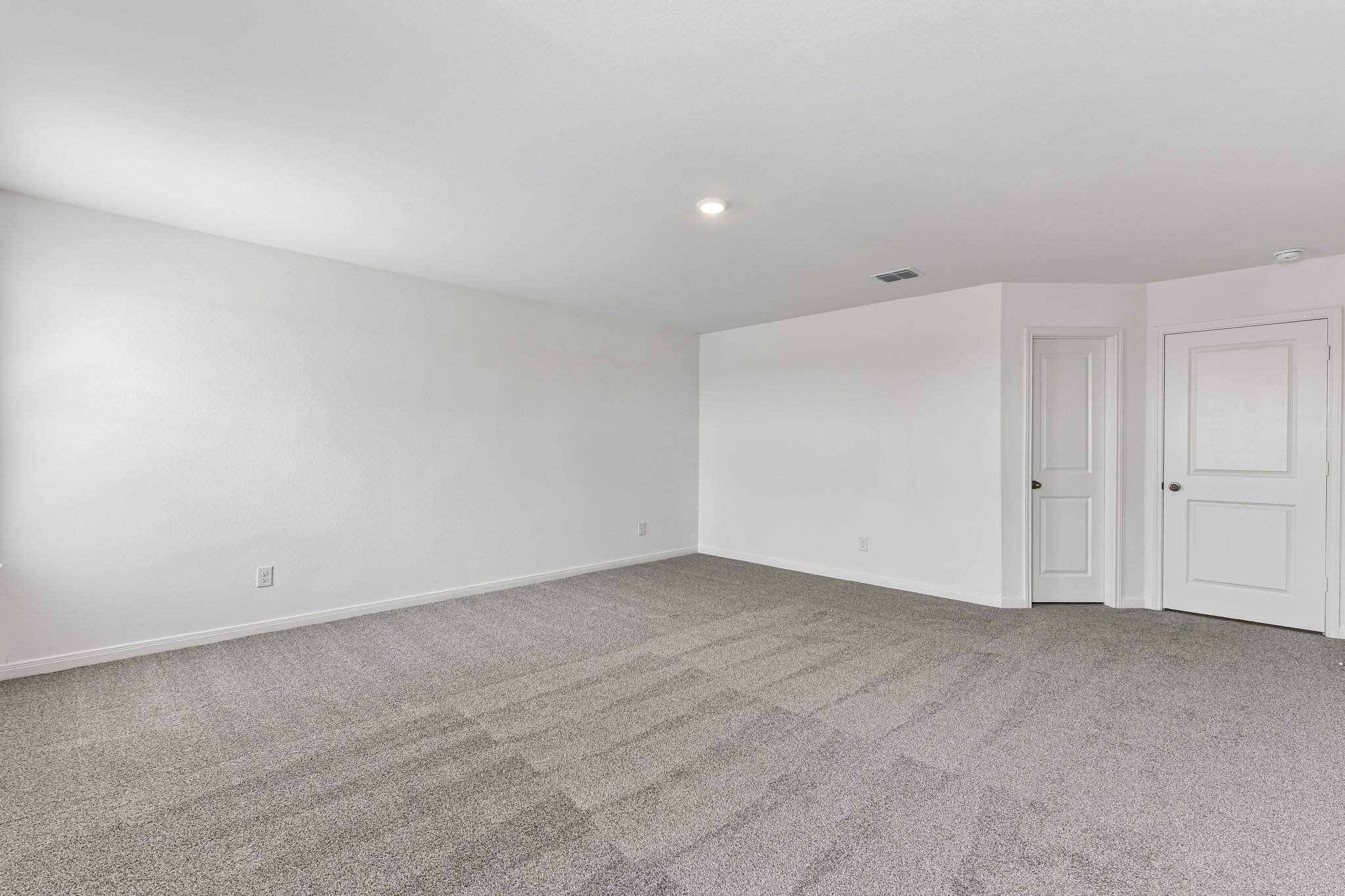 346 Low Pasture Trail Maxwell, TX 78656 - Photo 18 of 29 Spacious room featuring light gray carpet flooring and bright white walls