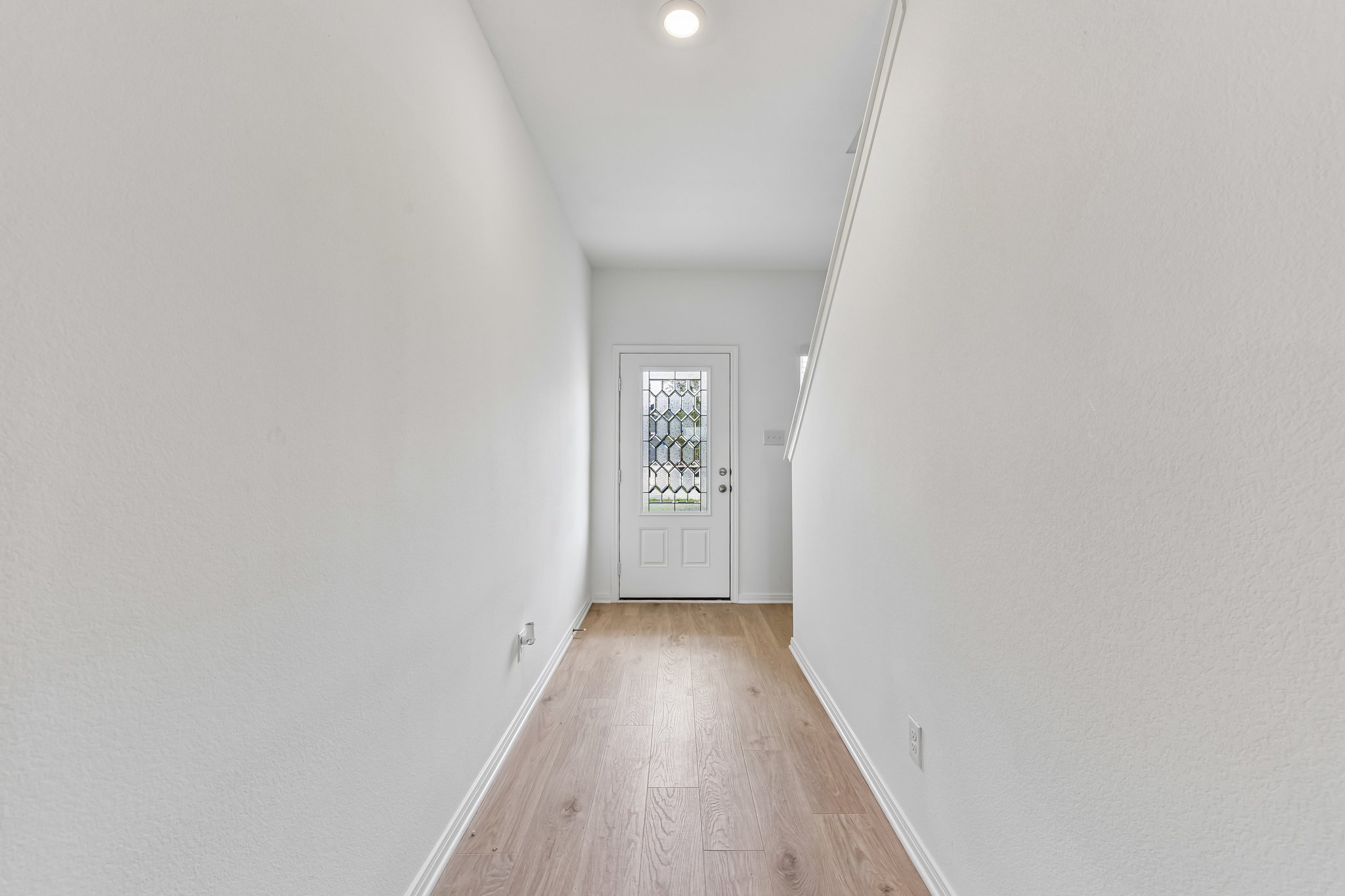346 Low Pasture Trail Maxwell, TX 78656 - Photo 2 of 29 Entryway featuring wood-finish flooring, white walls, and a recessed ceiling light