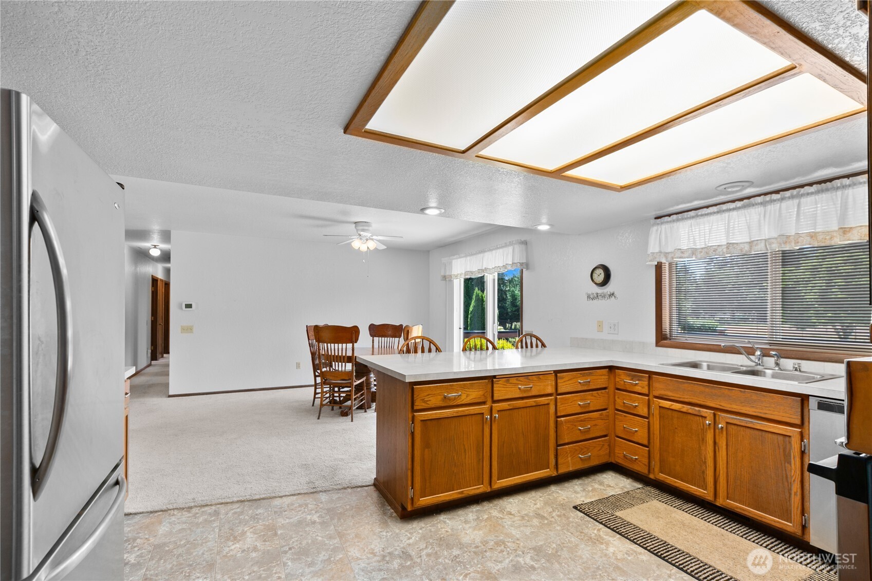 6929 Mission Road Everson, WA 98247 - Photo 11 of 36 a kitchen with a sink appliances and cabinets