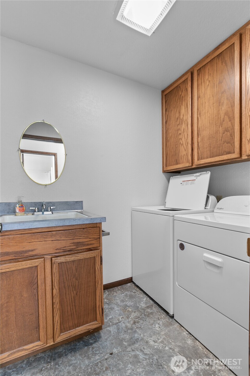 6929 Mission Road Everson, WA 98247 - Photo 17 of 36 a room with a sink cabinets and utility room