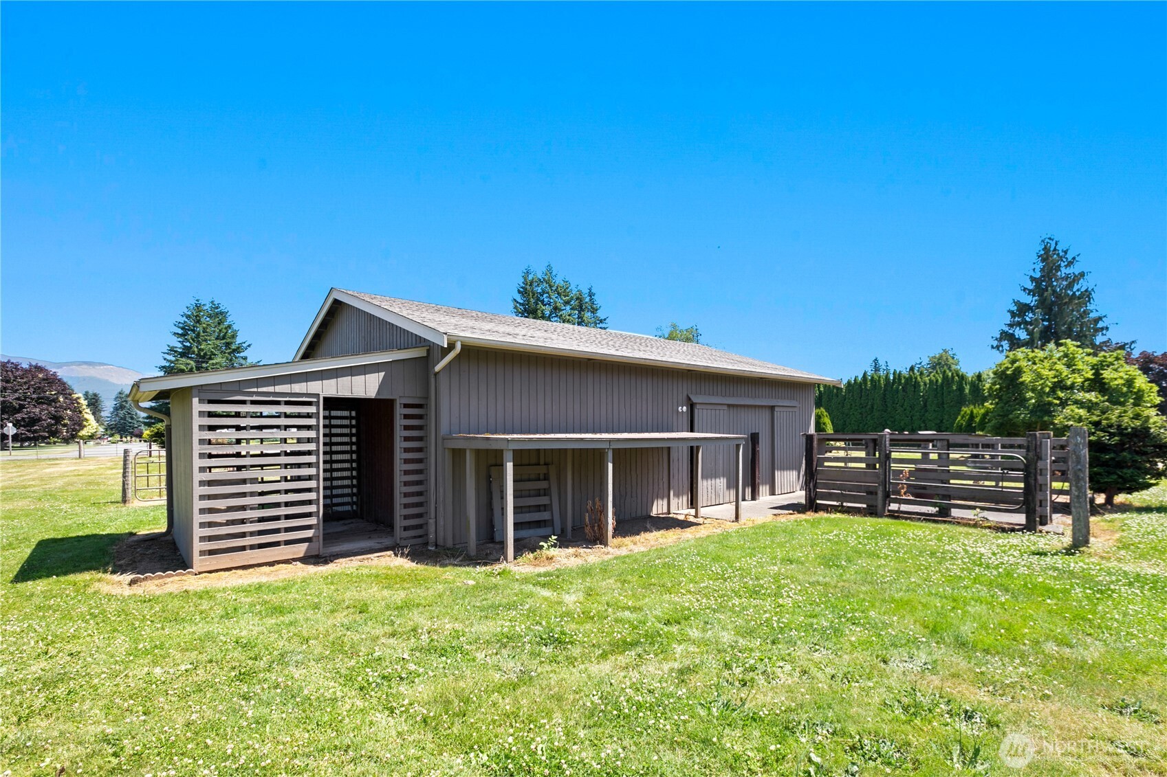6929 Mission Road Everson, WA 98247 - Photo 23 of 36 a front view of a house with a garden
