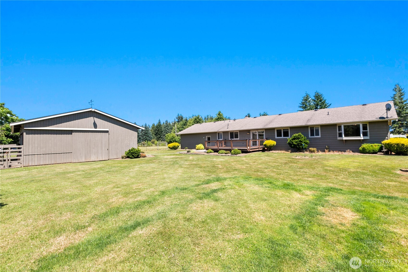 6929 Mission Road Everson, WA 98247 - Photo 25 of 36 a front view of a house with a yard and garage