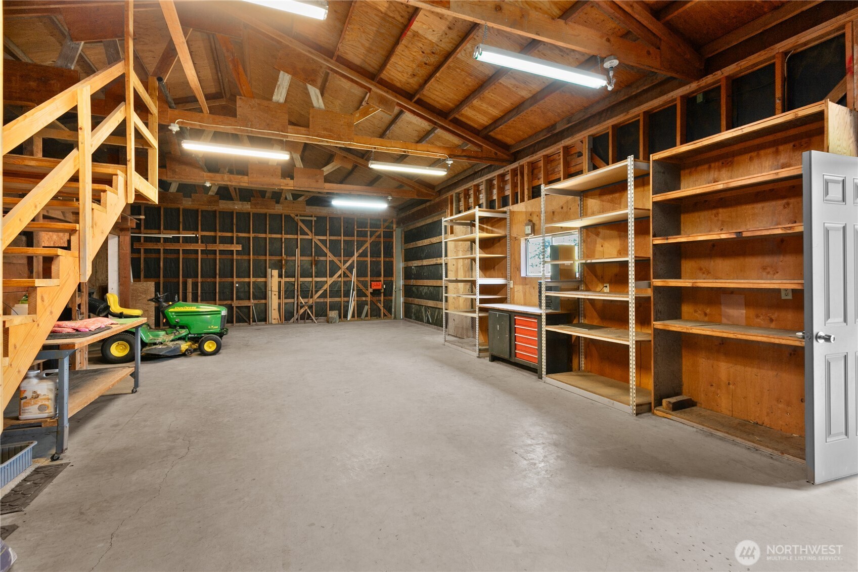 6929 Mission Road Everson, WA 98247 - Photo 30 of 36 a view of an empty room with storage