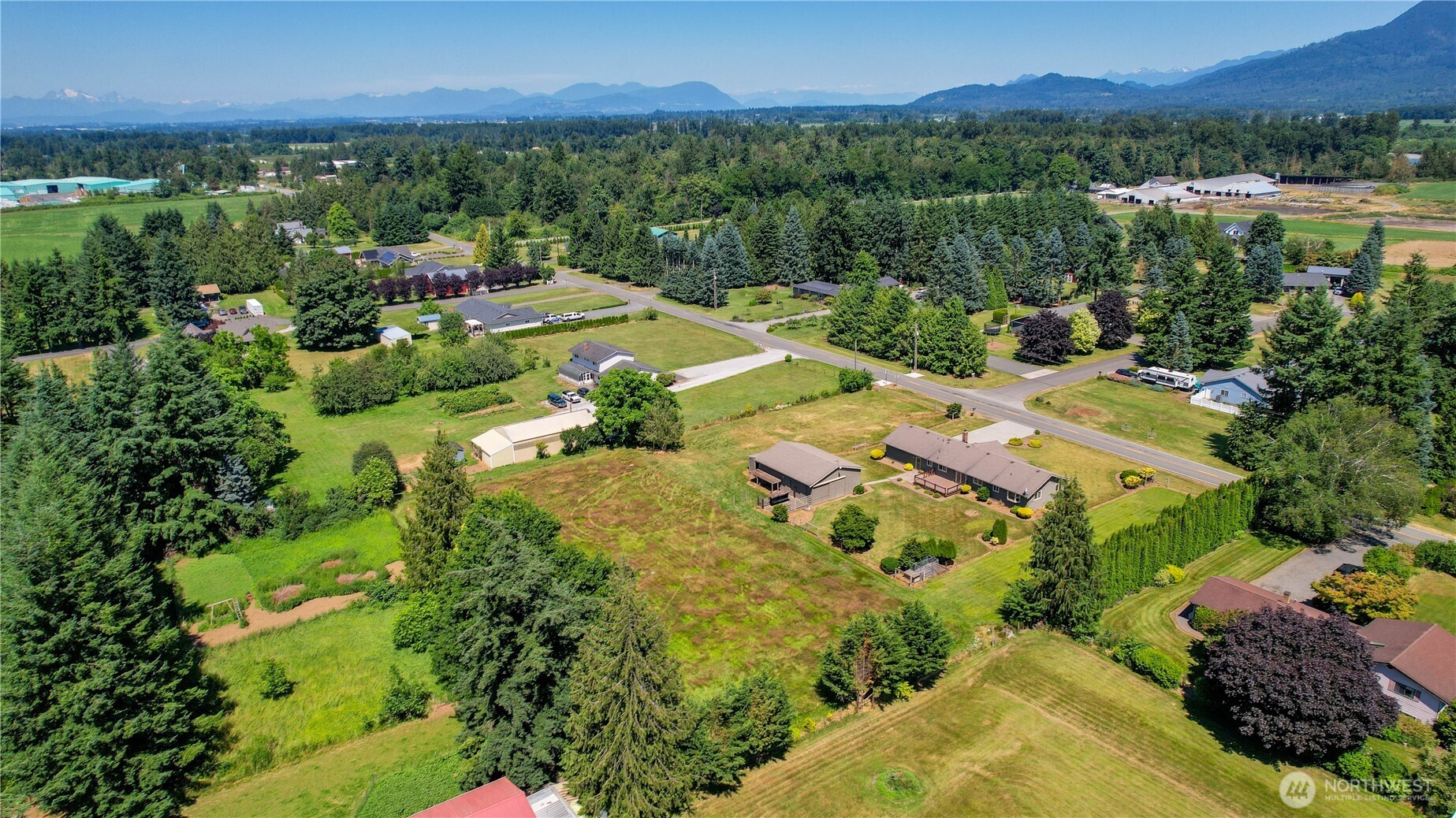 6929 Mission Road Everson, WA 98247 - Photo 33 of 36 a view of a lake with a yard