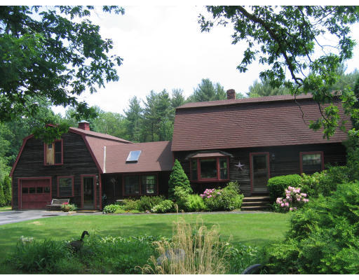 52 Gates Pond Road Berlin, MA 01503 - Photo 1 of 9 a view of a house with garden and yard