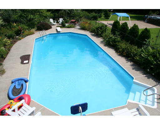 52 Gates Pond Road Berlin, MA 01503 - Photo 2 of 9 a view of swimming pool from a balcony