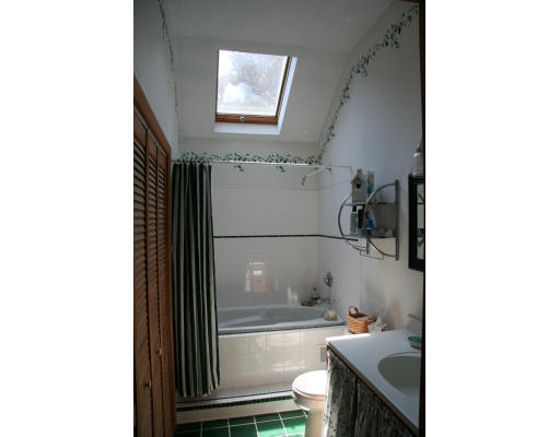 52 Gates Pond Road Berlin, MA 01503 - Photo 4 of 9 a bathroom with a sink and a mirror