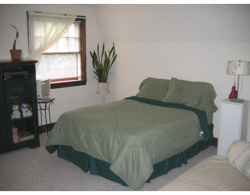 52 Gates Pond Road Berlin, MA 01503 - Photo 8 of 9 a bedroom with a bed and a window