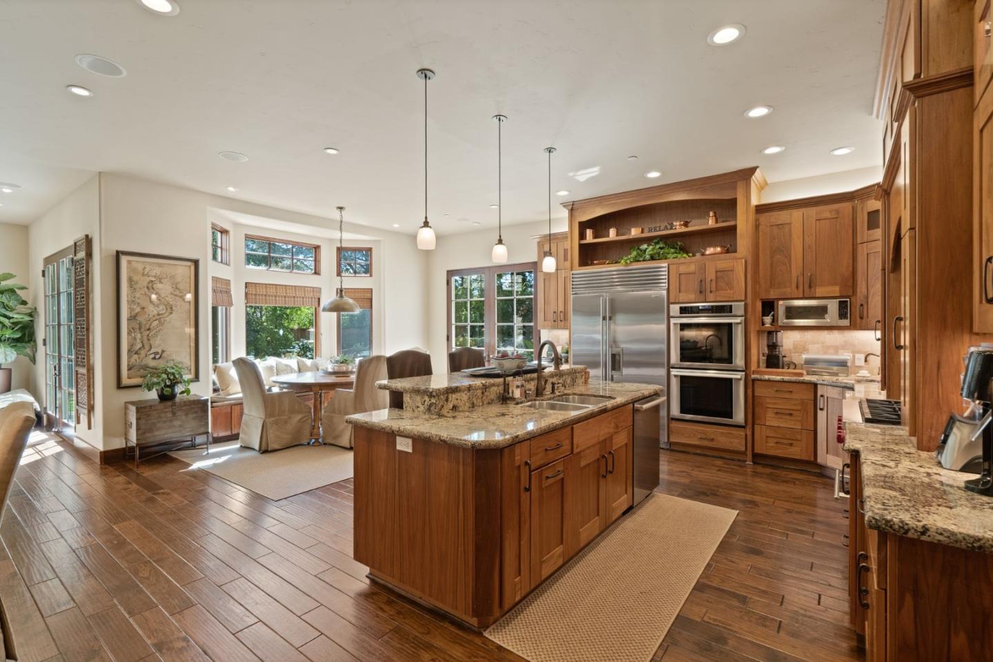 70 Joyce Road Hillsborough, CA 94010 - Photo 27 of 100 a kitchen with stainless steel appliances granite countertop a stove and a refrigerator