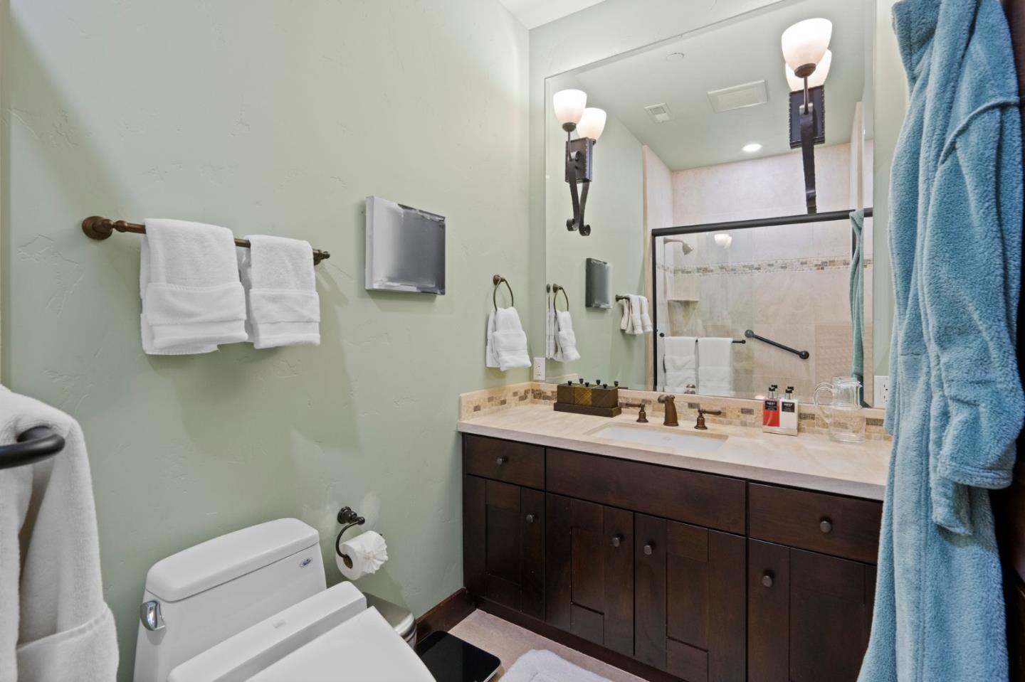 70 Joyce Road Hillsborough, CA 94010 - Photo 49 of 100 a bathroom with a double vanity sink toilet and mirror