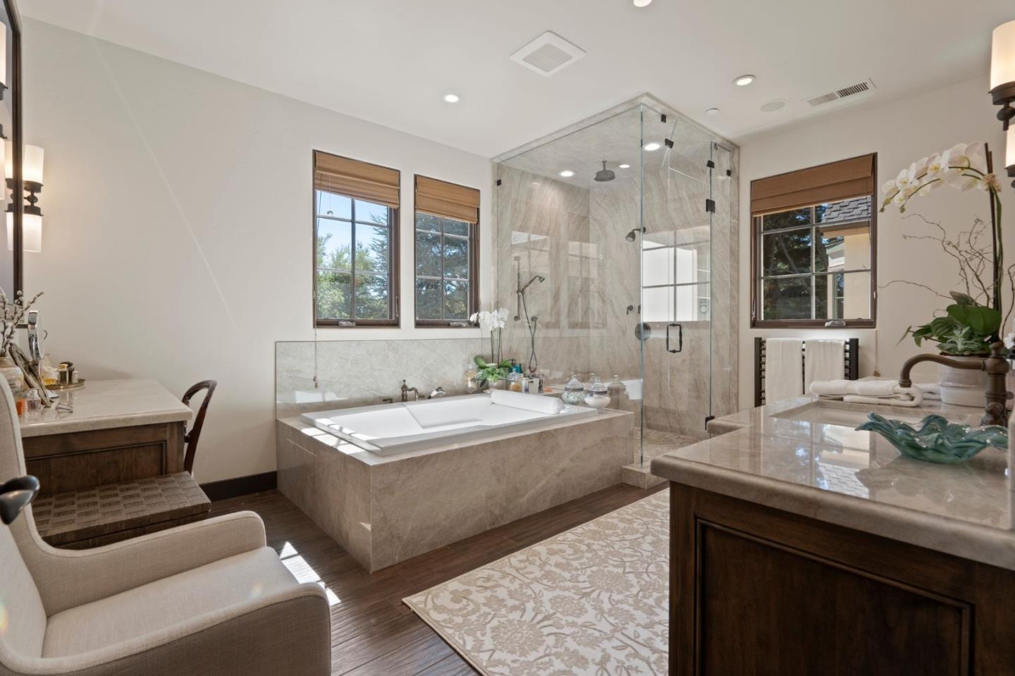 70 Joyce Road Hillsborough, CA 94010 - Photo 60 of 100 a spacious bathroom with a granite countertop tub sink and mirror